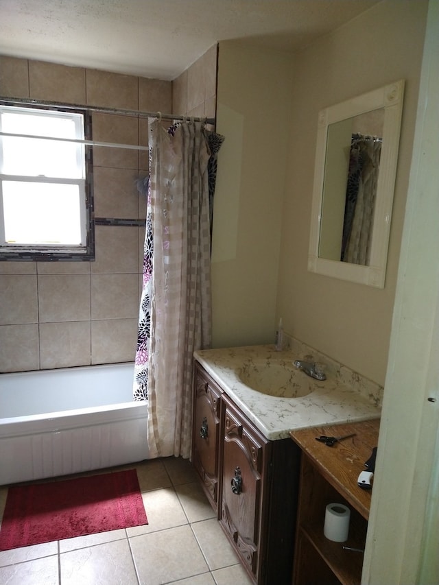 bathroom with tile patterned flooring, shower / bath combination with curtain, and vanity