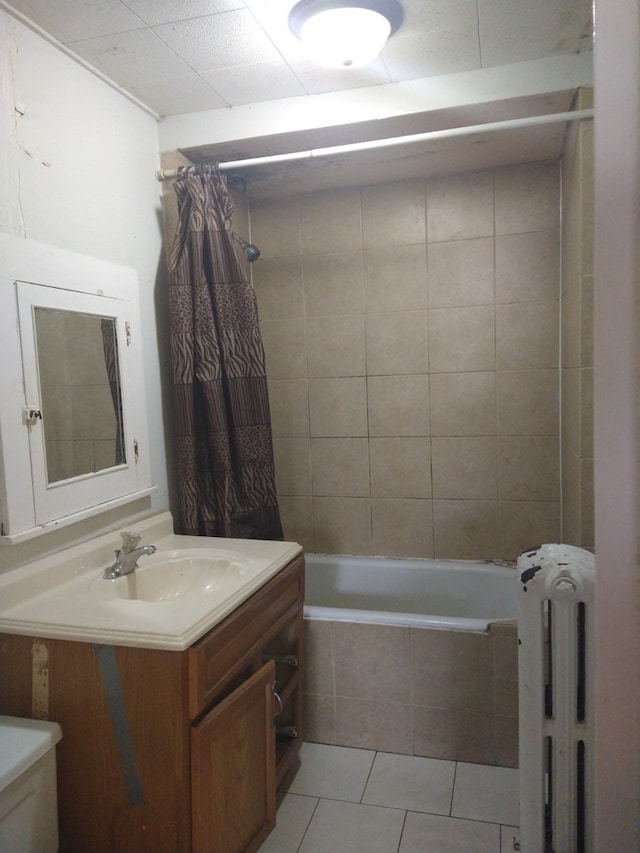 full bathroom featuring vanity, radiator, tile patterned flooring, toilet, and shower / bathtub combination with curtain