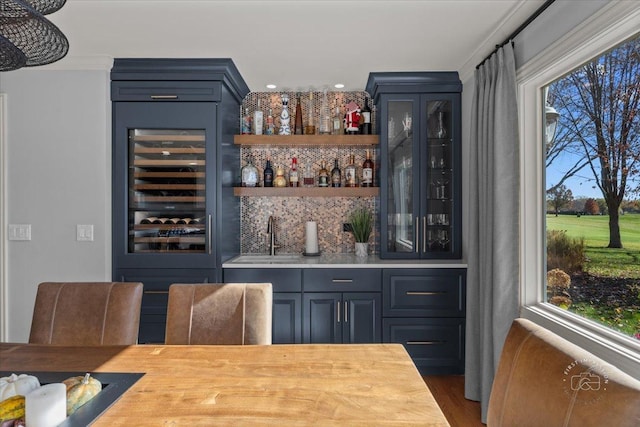 bar with sink, dark hardwood / wood-style floors, wine cooler, and decorative backsplash