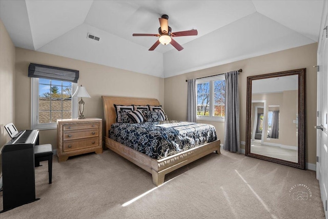 carpeted bedroom featuring lofted ceiling and ceiling fan