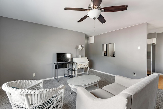 living room featuring carpet flooring and ceiling fan