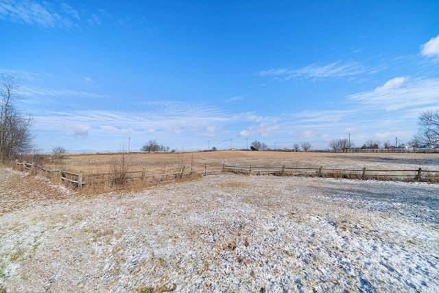 view of yard with a rural view