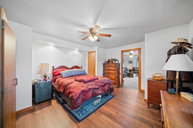 bedroom with hardwood / wood-style floors and ceiling fan