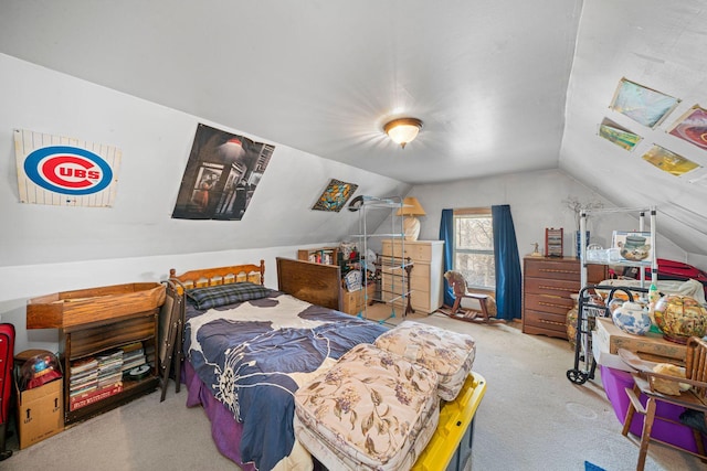 carpeted bedroom featuring lofted ceiling