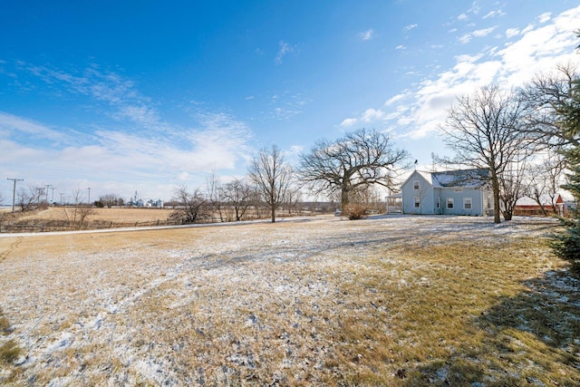 view of yard with a rural view