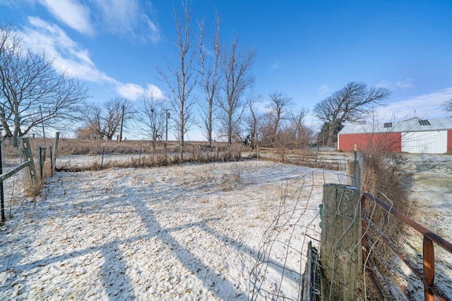 view of yard with a rural view