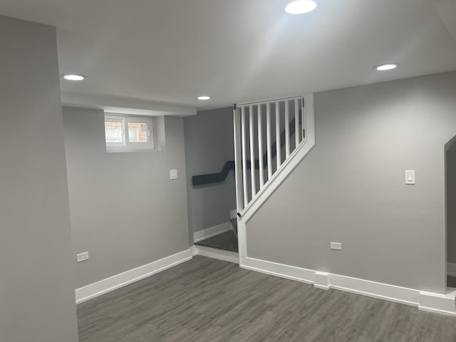 basement featuring dark hardwood / wood-style flooring