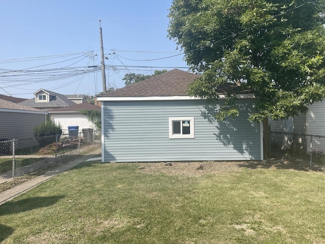 view of home's exterior featuring an outbuilding and a lawn