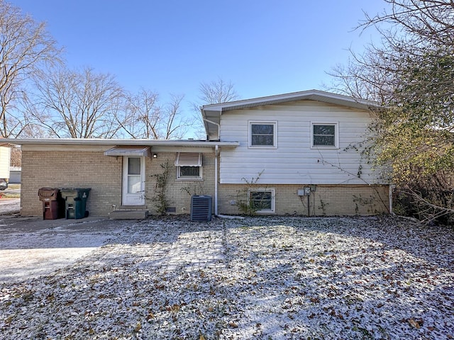 back of house with central AC