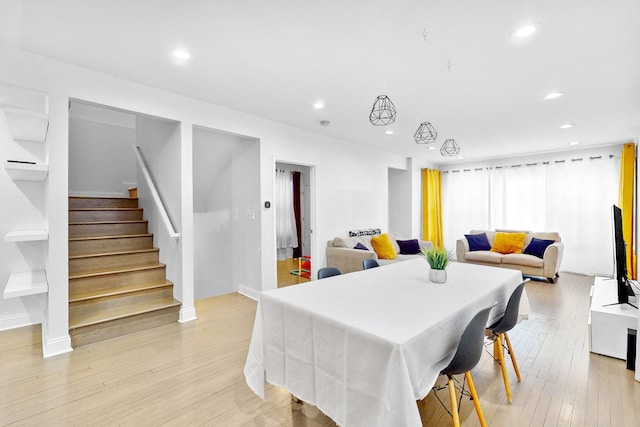 dining space featuring light wood-type flooring