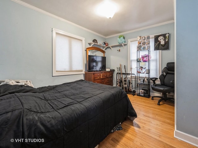 bedroom with crown molding and wood-type flooring