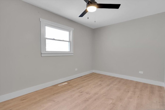 unfurnished room with ceiling fan and light hardwood / wood-style floors