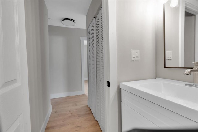 bathroom featuring vanity and wood-type flooring