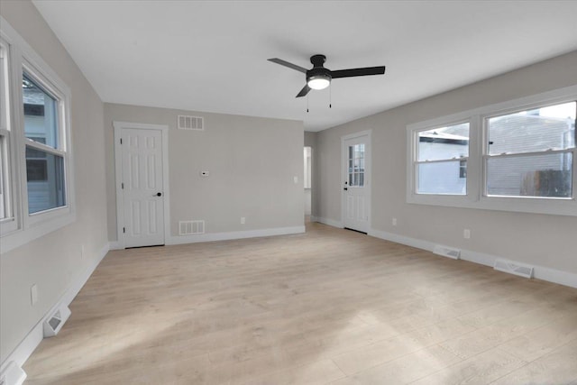 empty room featuring ceiling fan and light hardwood / wood-style floors