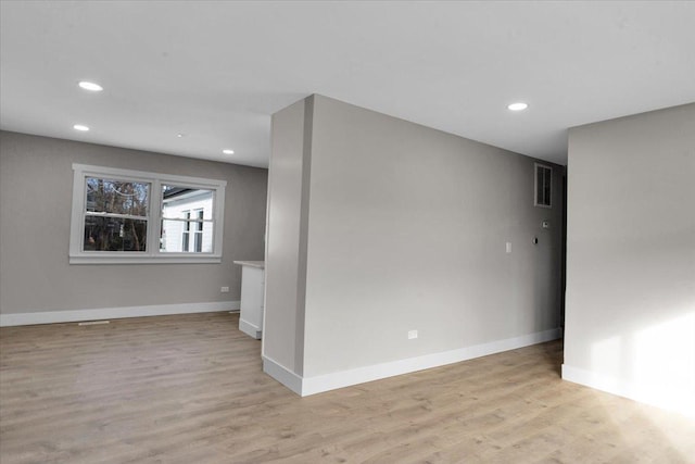 spare room with light hardwood / wood-style floors