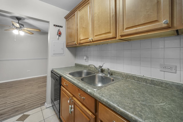 kitchen with ceiling fan, sink, black dishwasher, tasteful backsplash, and light tile patterned flooring