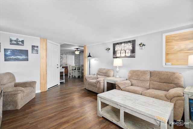 living room featuring dark hardwood / wood-style flooring and ceiling fan