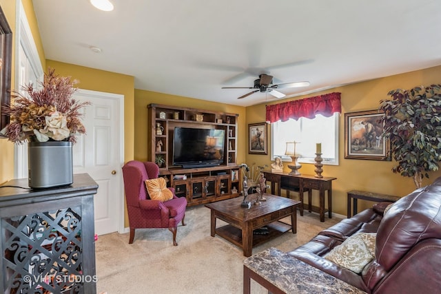 living room featuring light colored carpet and ceiling fan