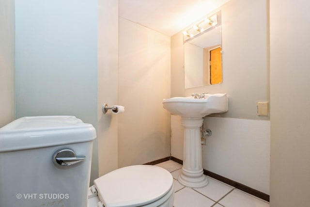 bathroom featuring toilet and tile patterned floors