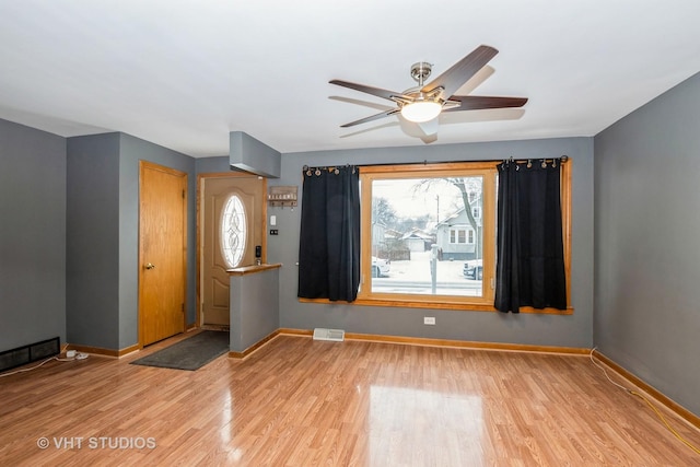 unfurnished room with ceiling fan and light hardwood / wood-style flooring