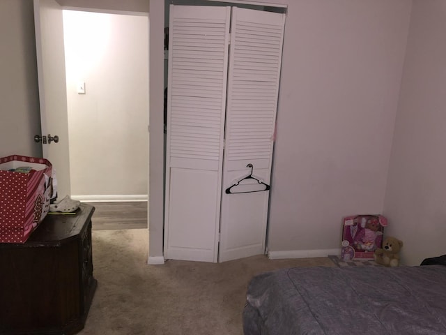 carpeted bedroom featuring a closet