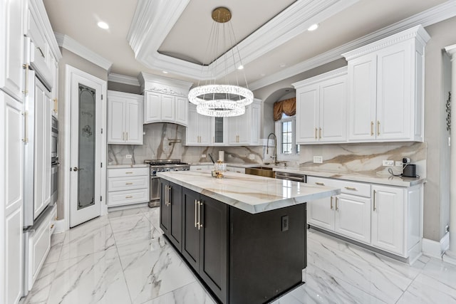 kitchen with white cabinetry, a center island, pendant lighting, and appliances with stainless steel finishes