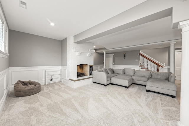 carpeted living room with a fireplace