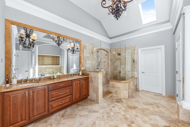 bathroom with lofted ceiling with skylight, vanity, ornamental molding, and tiled shower