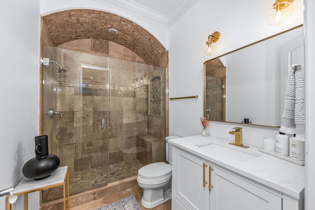 bathroom featuring toilet, vanity, ornamental molding, and walk in shower