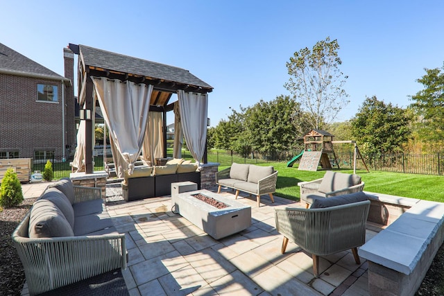 view of patio / terrace with a gazebo, a playground, and an outdoor living space with a fire pit