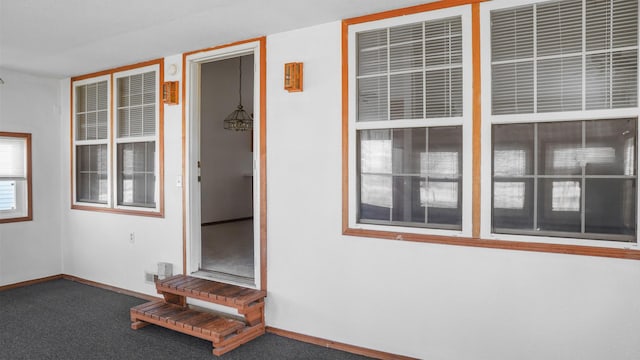 doorway to property with stucco siding