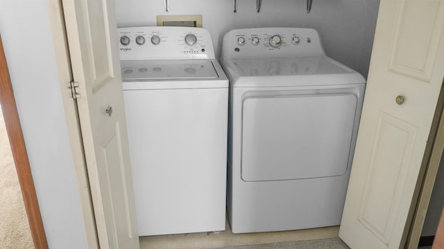 laundry room with laundry area and washer and clothes dryer