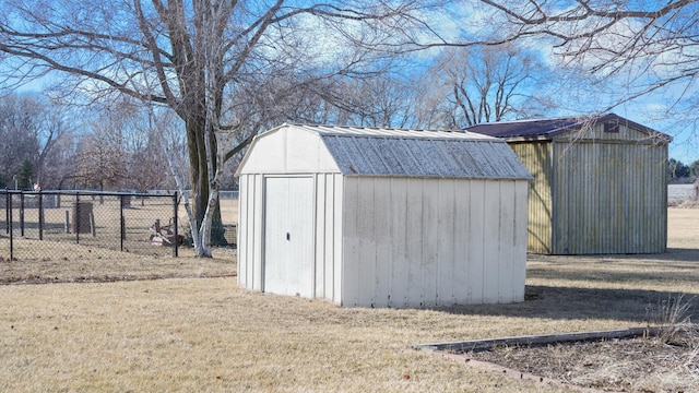 view of shed featuring fence