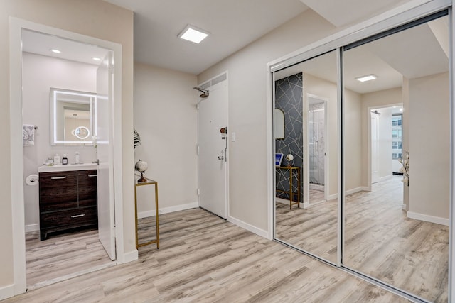 hallway featuring light wood-type flooring