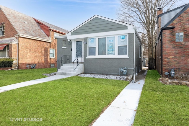 bungalow-style house featuring a front yard