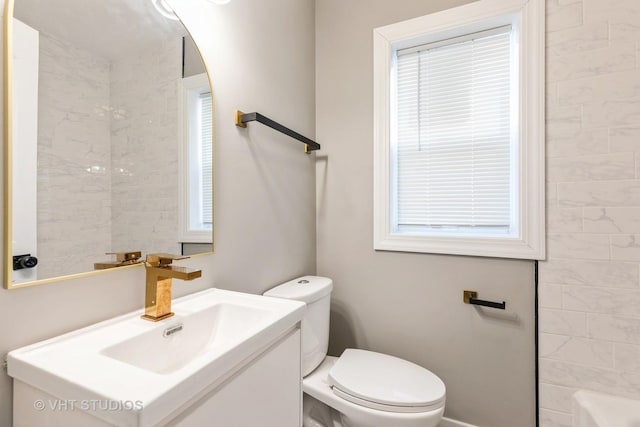 bathroom featuring toilet and vanity