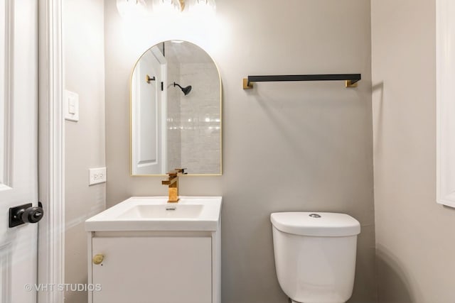 bathroom with toilet and vanity