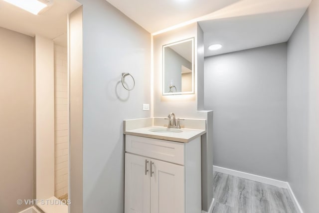 bathroom featuring vanity and hardwood / wood-style flooring