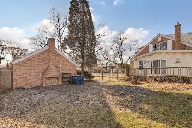 view of yard featuring a wooden deck