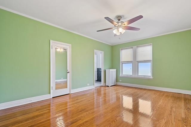 interior space featuring ceiling fan, light hardwood / wood-style floors, and crown molding