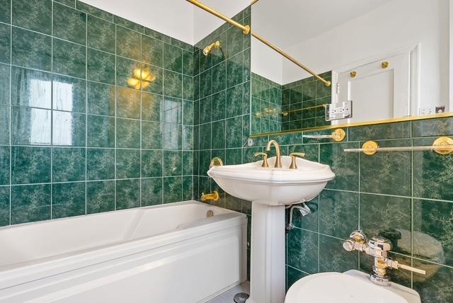 bathroom with shower / tub combination and tile walls