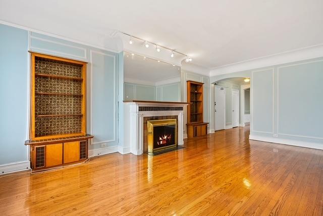 unfurnished living room with wood-type flooring and crown molding