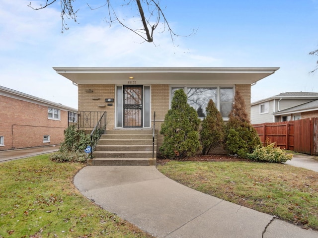 view of front of home with a front yard