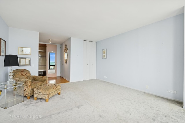 unfurnished room with baseboards and carpet flooring