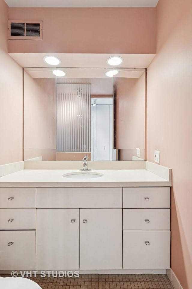 bathroom featuring visible vents and vanity