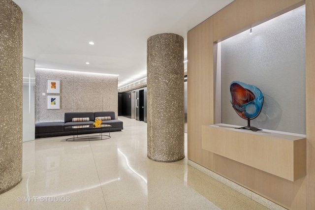 corridor featuring recessed lighting and speckled floor