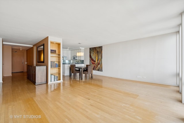 unfurnished living room featuring light wood finished floors