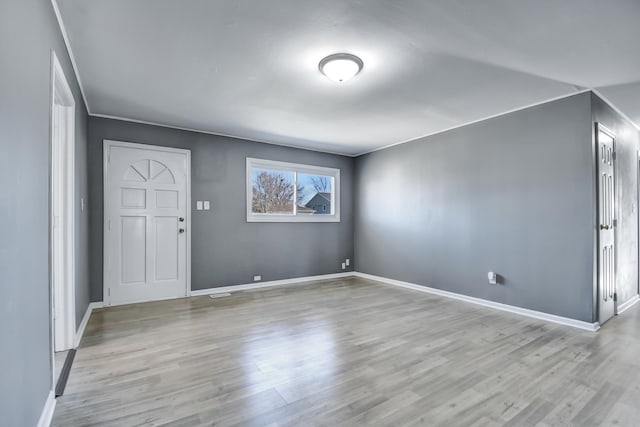 entrance foyer with light hardwood / wood-style flooring