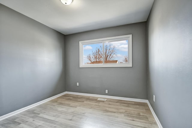 unfurnished room featuring light hardwood / wood-style flooring