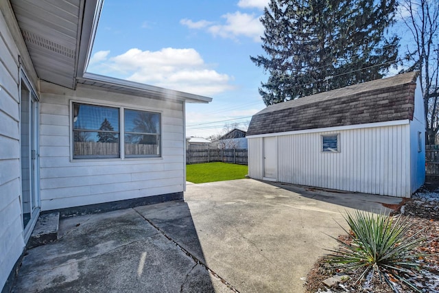 view of patio / terrace with a shed